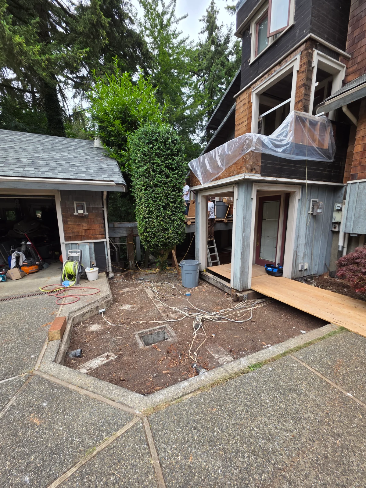 Extensive dry-rot restoration from the balconies to the foundation, including structural beam replacement and pressure-treated framing